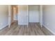 Bright bedroom features a large closet and neutral decor with wood flooring at 6399 Woodwell Dr, Union City, GA 30291