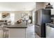 Bright, open kitchen and dining area features granite countertops and stainless steel appliances at 6399 Woodwell Dr, Union City, GA 30291