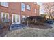 Exterior of a brick home with an outdoor patio, and a well maintained lawn at 1140 Matheson Way, Alpharetta, GA 30022