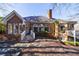 Beautiful brick home featuring a chimney, a well maintained yard, and an inviting deck at 1140 Matheson Way, Alpharetta, GA 30022