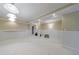 Finished basement with panelled walls, neutral carpet, and recessed lighting at 1140 Matheson Way, Alpharetta, GA 30022