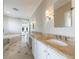 Bathroom featuring granite countertop, tiled floors, double vanity, walk-in shower, and soaking tub at 1140 Matheson Way, Alpharetta, GA 30022