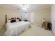 Bright bedroom featuring a queen bed, ceiling fan, and natural light from the window at 1140 Matheson Way, Alpharetta, GA 30022