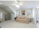 Bedroom featuring a cozy sitting area with a comfortable sofa, perfect for relaxing or reading at 1140 Matheson Way, Alpharetta, GA 30022