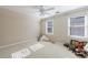 Cozy bedroom with carpet, natural light from two windows, and a ceiling fan at 1140 Matheson Way, Alpharetta, GA 30022