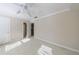 Empty bedroom with carpet, neutral paint, crown molding, and natural light at 1140 Matheson Way, Alpharetta, GA 30022