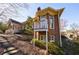 Back exterior of a two-story brick home with a small balcony and wooded landscape at 1140 Matheson Way, Alpharetta, GA 30022