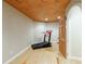 Home gym featuring hardwood floors, recessed lighting, and a wood accent ceiling at 1140 Matheson Way, Alpharetta, GA 30022
