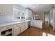 Bright kitchen features stainless steel appliances and gleaming hardwood floors at 1140 Matheson Way, Alpharetta, GA 30022
