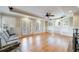 Living room with hardwood floors, fireplace, French doors, and abundant natural light at 1140 Matheson Way, Alpharetta, GA 30022