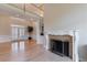 Living room boasts a cozy fireplace, hardwood floors, and large double doors; a bright and inviting space at 1140 Matheson Way, Alpharetta, GA 30022