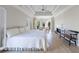 Large bedroom featuring hardwood floors, fireplace, seating, a tray ceiling, and abundant natural light at 1140 Matheson Way, Alpharetta, GA 30022