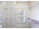 Walk-in closet with built-in storage, drawers, and natural light at 1140 Matheson Way, Alpharetta, GA 30022