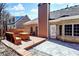 Brick house featuring a backyard patio, wooden deck, and outdoor seating at 3065 Kings Nw Dr, Kennesaw, GA 30144
