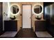 This bathroom features two vessel sinks, round mirrors and contemporary vanities at 3065 Kings Nw Dr, Kennesaw, GA 30144