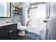Well-organized bathroom with a shower-tub combination and practical storage shelves at 3065 Kings Nw Dr, Kennesaw, GA 30144