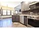 Modern kitchen with stainless steel appliances, gray cabinets, and an open layout at 3065 Kings Nw Dr, Kennesaw, GA 30144