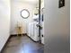 Bright laundry room with modern washer, dryer, water heater, and unique octagon window at 3065 Kings Nw Dr, Kennesaw, GA 30144