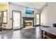 Comfortable living room featuring a fireplace, tile flooring, and neutral color scheme at 3065 Kings Nw Dr, Kennesaw, GA 30144