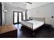 This main bedroom features dark wood floors, double doors to the back and a trey ceiling at 3065 Kings Nw Dr, Kennesaw, GA 30144