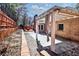 Brick house featuring a covered patio with outdoor lighting and curtains at 3065 Kings Nw Dr, Kennesaw, GA 30144