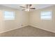 Cozy bedroom featuring neutral carpeting, two windows with blinds providing natural light at 1526 Colony East Cir, Stone Mountain, GA 30083