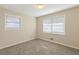 This bedroom has neutral walls, carpet flooring and natural light through two windows at 1526 Colony East Cir, Stone Mountain, GA 30083