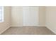 Bedroom featuring neutral walls, carpet flooring, natural light and a double door closet at 1526 Colony East Cir, Stone Mountain, GA 30083