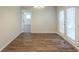 Dining area with wood flooring, French doors to backyard and views into other rooms at 1526 Colony East Cir, Stone Mountain, GA 30083