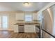 Bright kitchen featuring stainless steel appliances, granite countertops and ample cabinet space with wood floors at 1526 Colony East Cir, Stone Mountain, GA 30083