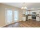 Open kitchen with stainless steel appliances, granite countertops, and access to outdoor light from French doors at 1526 Colony East Cir, Stone Mountain, GA 30083