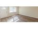 Sunlit living room featuring wood flooring and a bright, inviting atmosphere with access to backyard at 1526 Colony East Cir, Stone Mountain, GA 30083