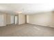 Expansive living room featuring neutral walls, plush carpeting, and bright natural light at 1526 Colony East Cir, Stone Mountain, GA 30083