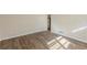 Inviting living room featuring wood flooring with natural light coming through window at 1526 Colony East Cir, Stone Mountain, GA 30083