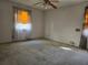 Bedroom featuring a ceiling fan and bright windows with patterned curtains, offering natural light at 1840 Sw King Alfred Sw Dr, Atlanta, GA 30331
