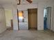 Bedroom with carpet, wallpapered walls, and a mirrored closet, offering a spacious interior at 1840 Sw King Alfred Sw Dr, Atlanta, GA 30331