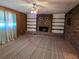View of living room featuring brick fireplace, neutral color walls, and carpet at 1840 Sw King Alfred Sw Dr, Atlanta, GA 30331