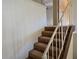 View of carpeted stairs with white railing leading to the upper level of the home at 1840 Sw King Alfred Sw Dr, Atlanta, GA 30331