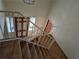 Foyer stairwell featuring carpeted stairs and a painted railing, leading to the front door at 1840 Sw King Alfred Sw Dr, Atlanta, GA 30331