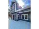 View of back deck and part of a blue two-story home exterior at 113 Miller Rd, Stockbridge, GA 30281