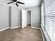 This bedroom features neutral walls, wood flooring, and a walk-in closet at 113 Miller Rd, Stockbridge, GA 30281