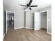 Bedroom with neutral walls, wood flooring, and walk-in closet at 113 Miller Rd, Stockbridge, GA 30281