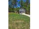 Charming home with a landscaped yard, paved driveway, and an attached two-car garage at 113 Miller Rd, Stockbridge, GA 30281