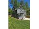 Beautiful two-story home with gray siding, white trim, and a charming covered front porch at 113 Miller Rd, Stockbridge, GA 30281