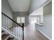 Bright, open-concept living room featuring hardwood floors and access to the deck via sliding glass doors at 113 Miller Rd, Stockbridge, GA 30281