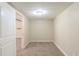 Neutral carpeted room with white trim offers versatility as a home office, playroom, or home gym at 2167 Kilarney Rd, Decatur, GA 30032