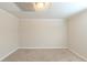 Carpeted bonus room features a neutral color palette and plenty of space for a variety of uses at 2167 Kilarney Rd, Decatur, GA 30032