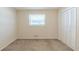 Cozy bedroom featuring a bright window and spacious closet at 2167 Kilarney Rd, Decatur, GA 30032