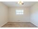 Bright bedroom features neutral carpeting and a ceiling fan at 2167 Kilarney Rd, Decatur, GA 30032