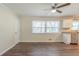 Bright dining area featuring modern flooring and a view of the updated kitchen at 2167 Kilarney Rd, Decatur, GA 30032